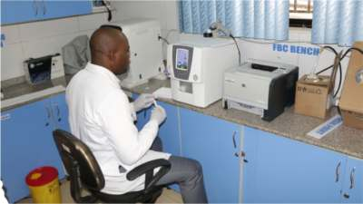 Laboratory scientist using diagnostic equipment